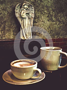 Hot cappuccino coffee in a drinking glass Placed on the table in a warm atmosphere. There is space for text