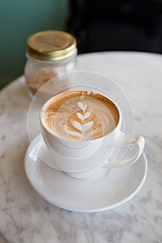 Hot cappuccino with latte art