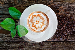 Hot cappuccino on wood table