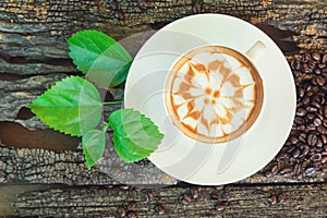 Hot cappuccino on wood table