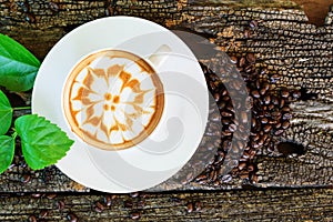 Hot cappuccino on wood table