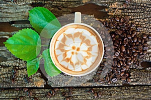 Hot cappuccino on wood table