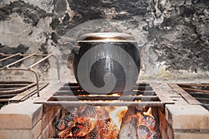 Hot cauldron on a fire