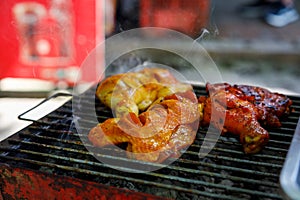 Hot chicken grilled on one of the streets of Koh Samui