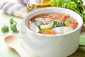 Hot chicken soup with vegetables