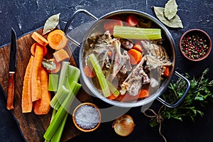 Hot chicken stock in a metal stockpot photo