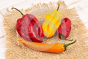 Hot chili pepper on grey wood