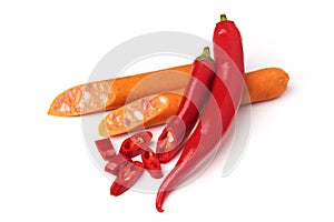 Hot chili pepper and sausages isolated on white background