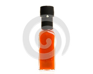 Hot Chili Sauce glass bottle on white background.