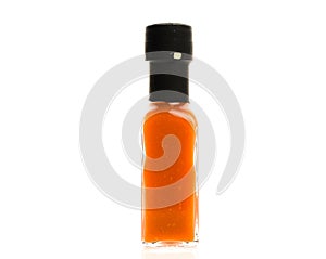 Hot Chili Sauce glass bottle on white background.