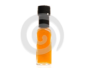 Hot Chili Sauce glass bottle on white background.