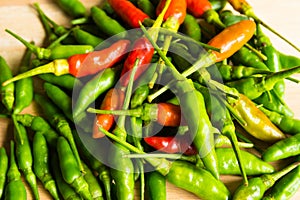 Hot chilli peppers on table