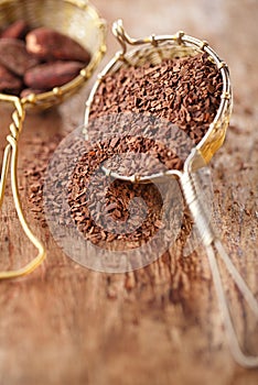 hot chocolate flakes with chilli flavor in old rustic style silver sieve