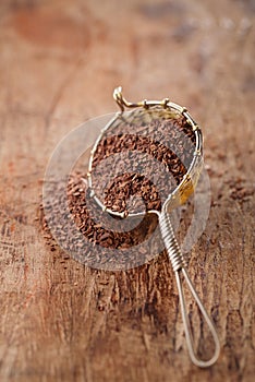 hot chocolate flakes with chilli flavor in old rustic style silver sieve