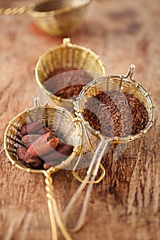 hot chocolate flakes with chilli flavor in old rustic style silver sieve