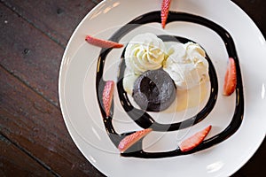 Hot chocolate lava cake with vanilla ice cream and fresh strawberry