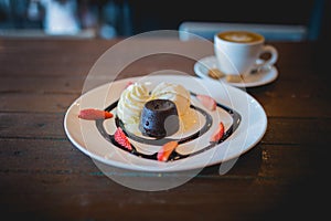 Hot chocolate lava cake with vanilla ice cream and fresh strawberry