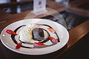 hot chocolate lava cake with vanilla ice cream and fresh strawberry