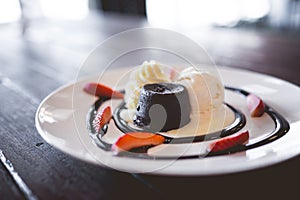 hot chocolate lava cake with vanilla ice cream and fresh strawberry