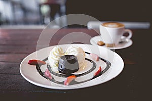 hot chocolate lava cake with vanilla ice cream and fresh strawberry