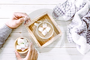 Hot chocolate and marshmallow on wooden background