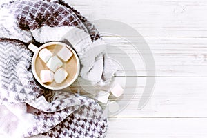 Hot chocolate and marshmallow on wooden background