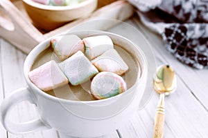 Hot chocolate and marshmallow on wooden background