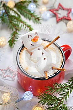 Hot chocolate with melted marshmallow snowman