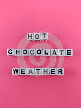 Hot chocolate weather winter themed poster on a pink background