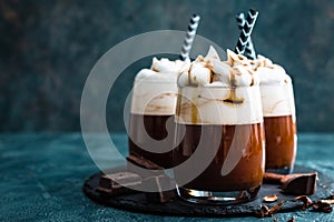 Hot chocolate with whipped cream. Chocolate dessert drink in glass