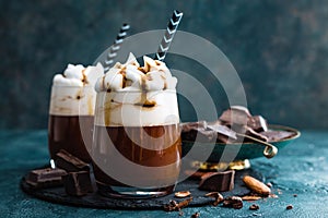 Hot chocolate with whipped cream. Chocolate dessert drink in glass