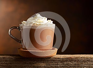 Hot chocolate with whipped cream in a glass mug