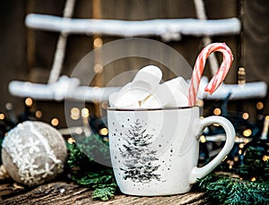 hot Christmas drink with marshmallow on wooden table