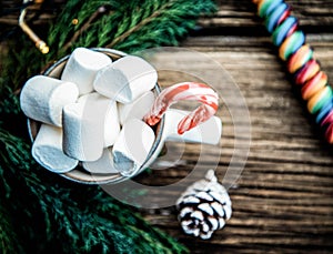 hot Christmas drink with marshmallow on wooden table