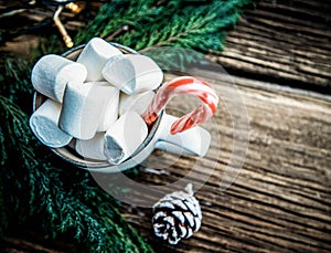 hot Christmas drink with marshmallow on wooden table