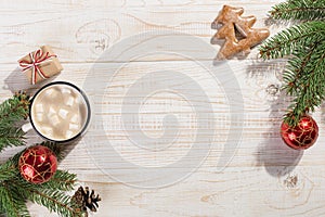 Hot Christmas drink with marshmallows in an iron mug and gingerbread cookies, on a white table. New Year, holiday background,