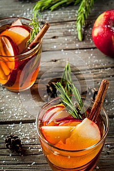Hot cocktail with apple, rosemary, cinnamon