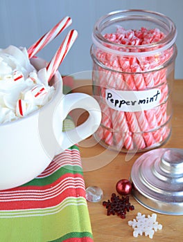 Hot coco Mocca with peppermint sticks jar and snow flakes photo