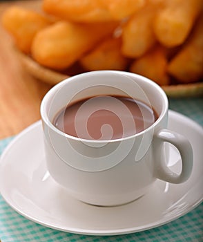 Hot cocoa with deep fried dough stick for breskfast