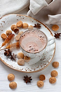 Hot cocoa drink with cookies, anise and  vanilla