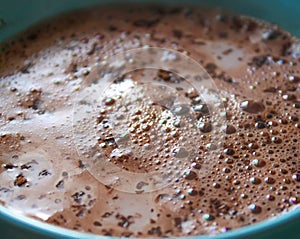 Hot cocoa with milk in ceramics cup.