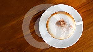 Hot coffee cappuccino latte top view on wooden table background