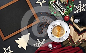 Hot coffee and christmas and happy new year day greeting wooden frame on black table background