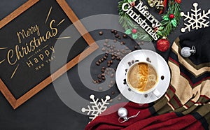 Hot coffee and christmas and happy new year day greeting wooden frame on black table background