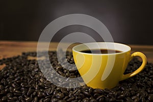 Hot Coffee cup and coffee beans. photo