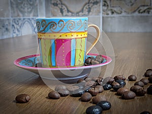 Hot Coffee in Coffee Cup with Saucer and coffee beans on Wooden Table