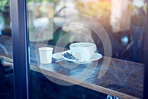 Hot coffee cup on table in cafe