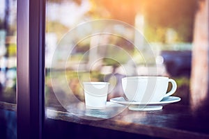 Hot coffee cup on table in cafe