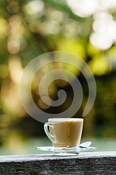 Hot coffee in glass for break with beautifull blur background