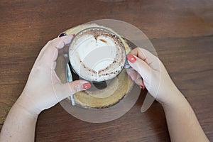 hot coffee with heart shape coffee foam